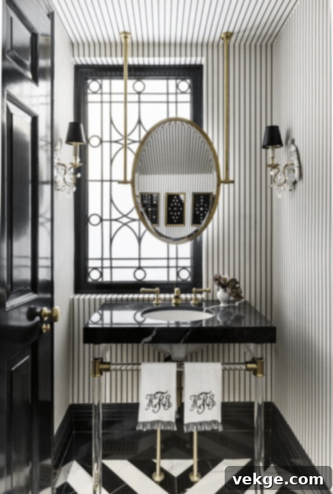Art Deco powder room with elegant leaded-glass window, silk wallpaper, and antique parrot sconces