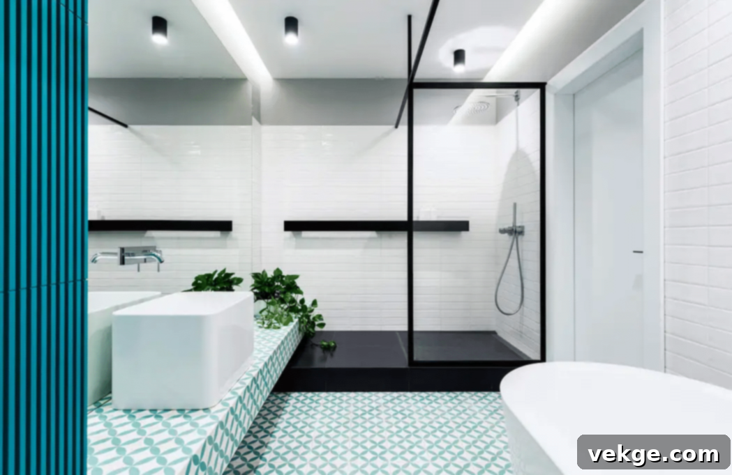 Modern bathroom with blue-green floral pattern tiles, black accents, freestanding bath, and shower