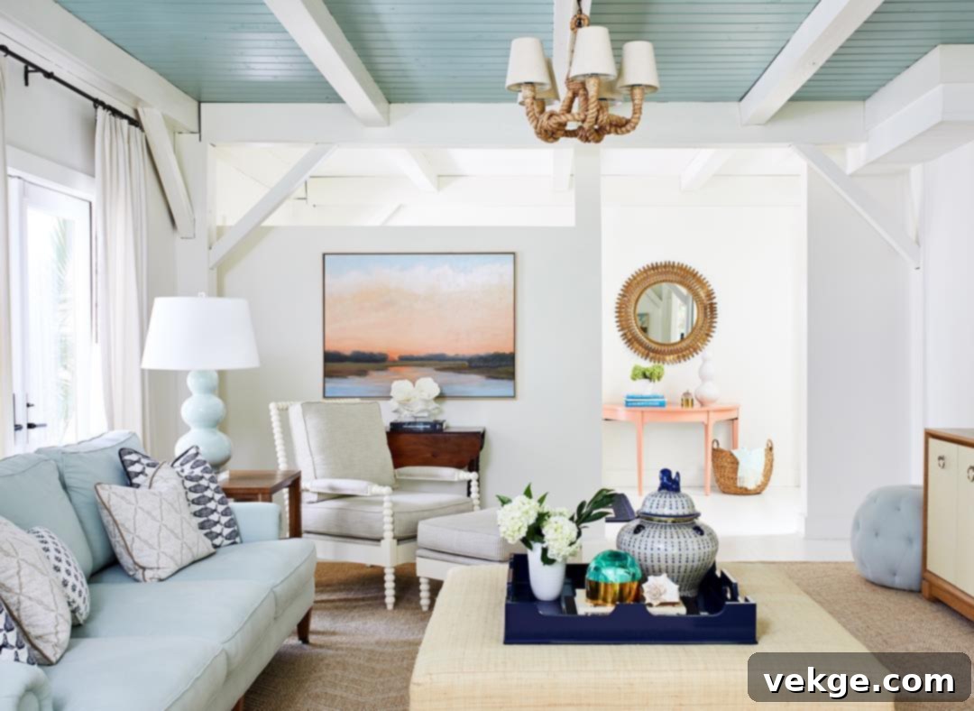 Coastal Living Room with Painted Blue Shiplap Ceiling and White Beams