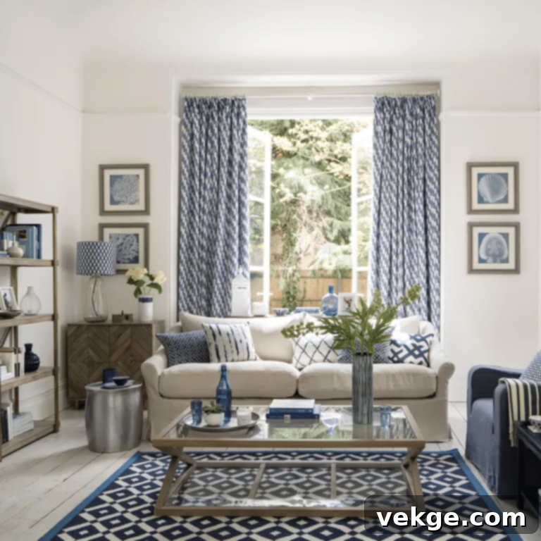 Mediterranean style coastal living room with blue, white, oatmeal sofa, and hammered metal accents