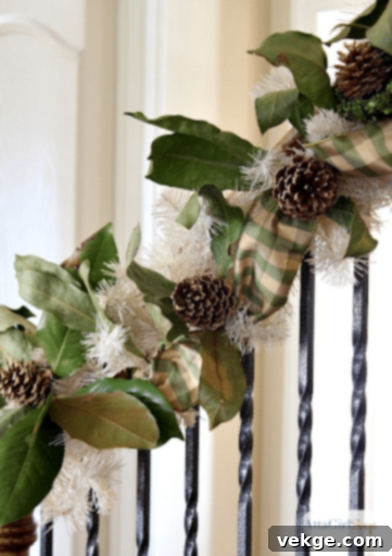 DIY Christmas garland with rustic pine cone decorations on a staircase