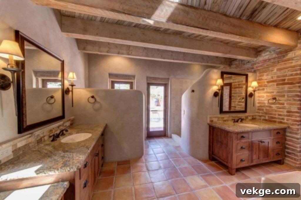 A bathroom with vibrant Southwestern decor, featuring patterned terracotta tiles on the floor and walls, complemented by rustic fixtures and a bright, inviting atmosphere.