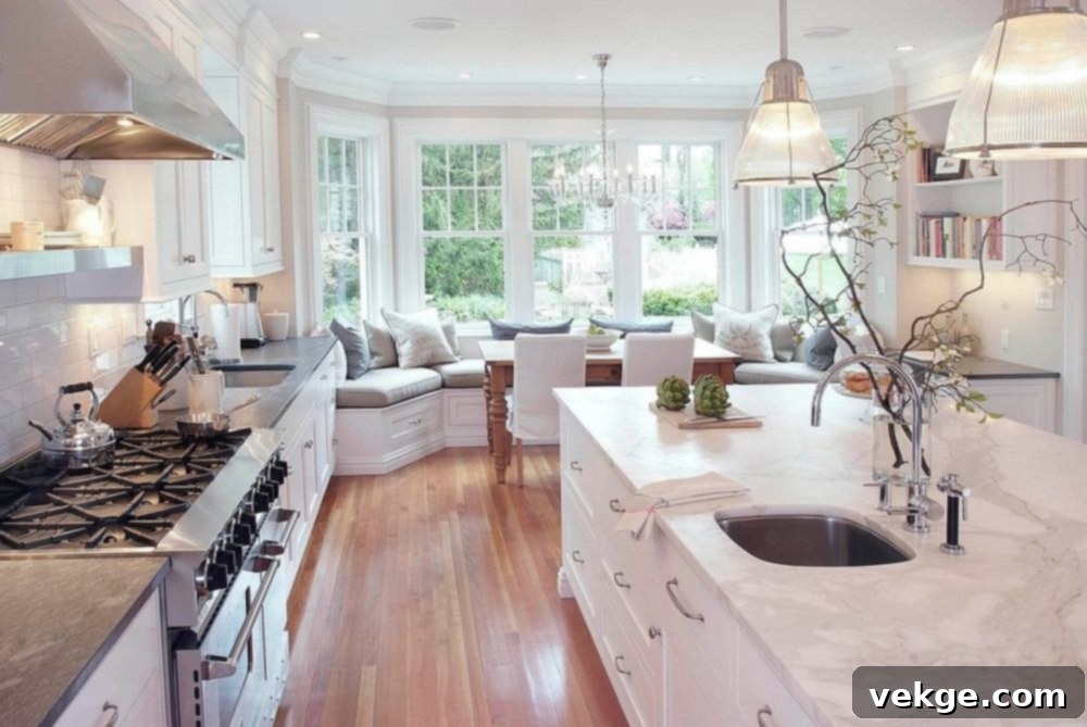 Spacious modern kitchen in white with comfy window seating
