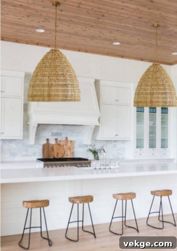 Pendant light kitchen decor: Modern kitchen with stylish rattan pendant lights over an island, enhancing a soft boho feel.