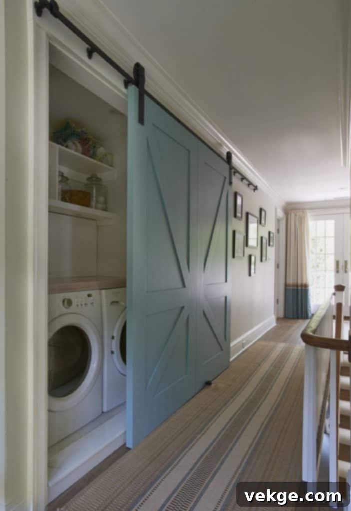 Beautiful Blue Barn Door Hiding Washer and Dryer