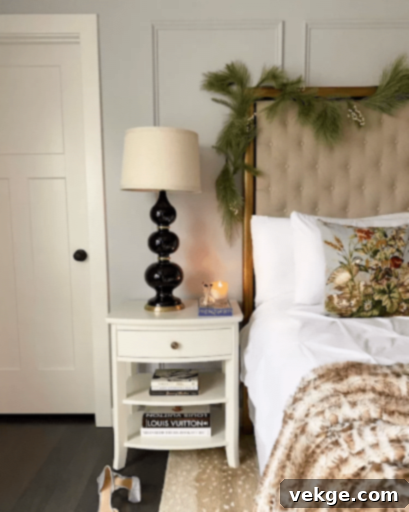 Christmas bedroom with greenery draped over a headboard