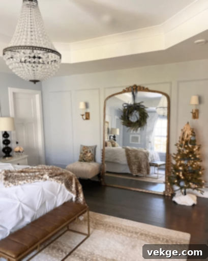 Christmas bedroom with a decorated mini tree and ribbon wreath