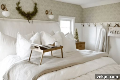 Neutral and minimal Christmas bedroom with a half wreath and mini tree