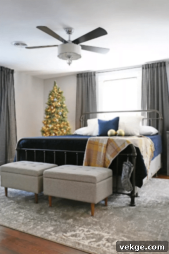 Christmas bedroom mixing cool navy, gray, white with warm gold tones