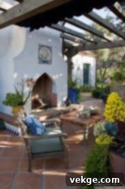 Outdoor living space with fountain and tiled wall