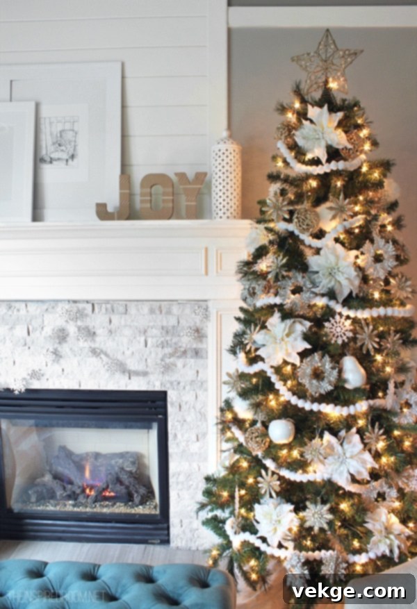 Wintry Wonderland Christmas Tree adorned with white and silver ornaments and glowing lights, creating a magical atmosphere
