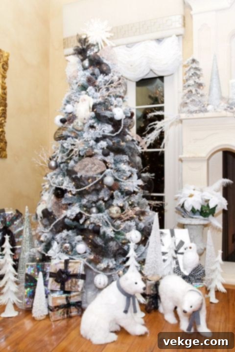 Hanging polar bear ornament on a Christmas tree, adding a cute and whimsical touch to white decor