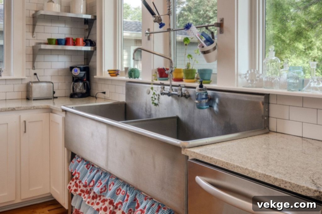 Sleek metal sink with steel faucet, ideal for an industrial kitchen