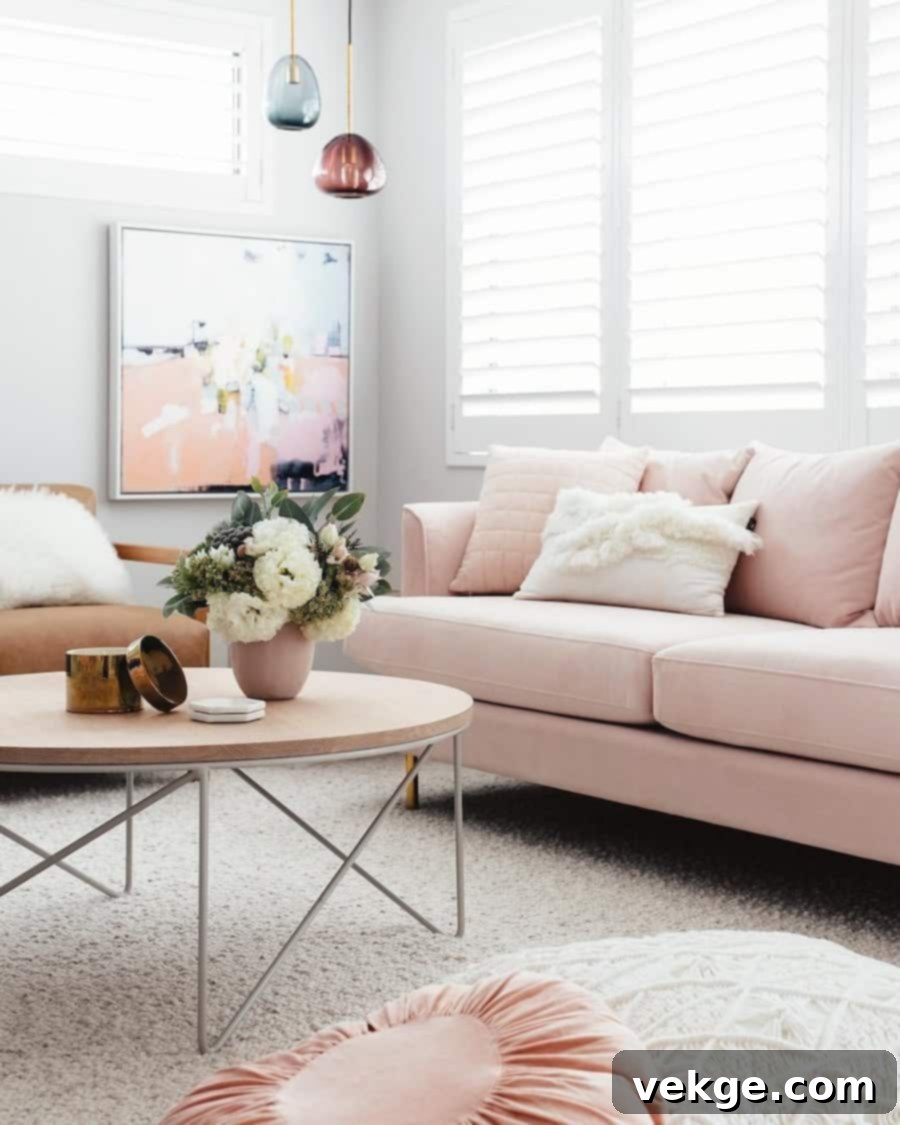 Blush Pink Sofa with Abstract Art