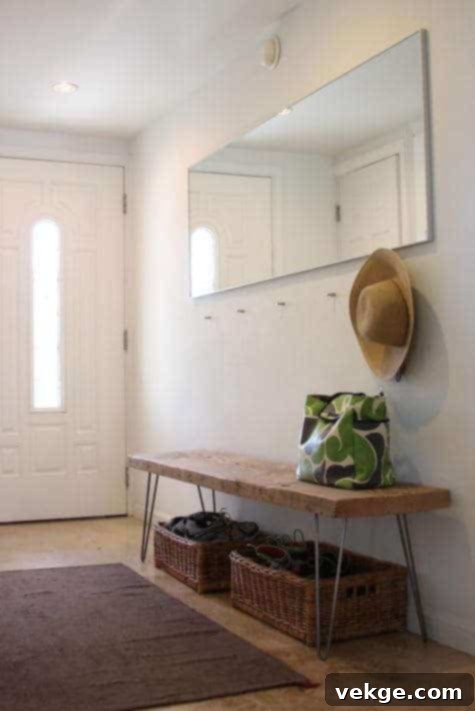 entryway bench with built-in storage and coat hooks for organization