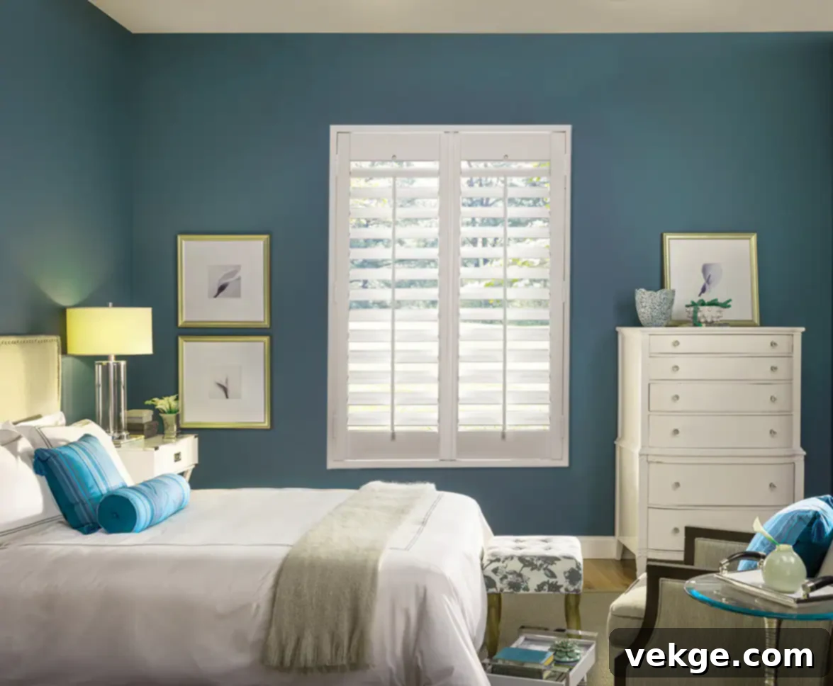 Elegant window treatments including curtains and blinds in a well-decorated bedroom.