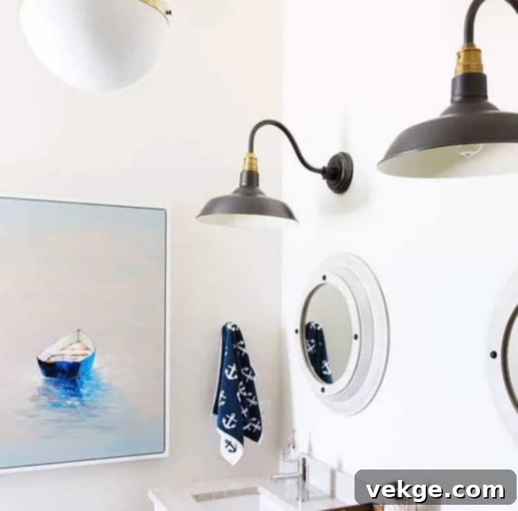 white bathroom with anchor towel and boat painting