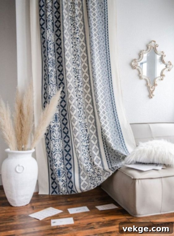 Bedroom with light, patterned boho curtains, adding a relaxed coastal touch