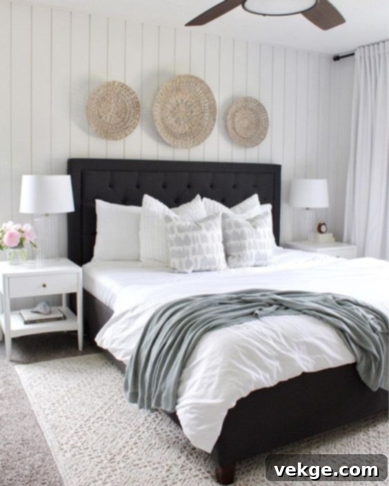 Modern coastal bedroom with black and white decor, showing a striking contrast