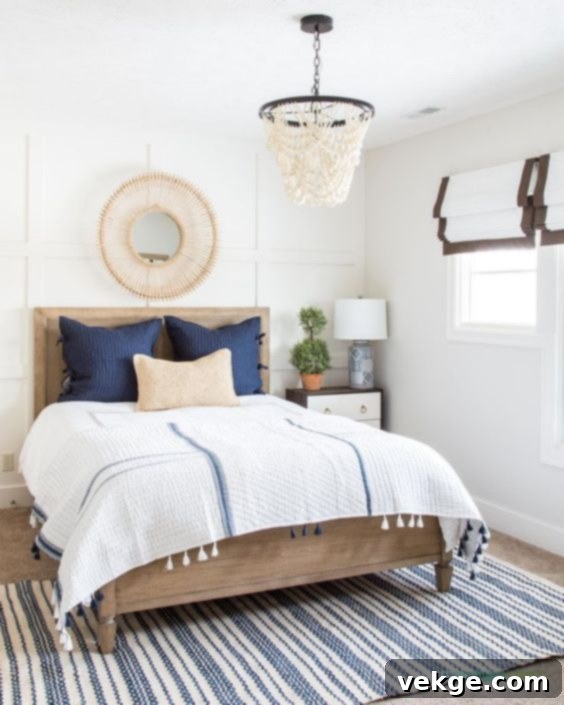 Coastal bedroom with a blue and white striped rug, adding a nautical touch