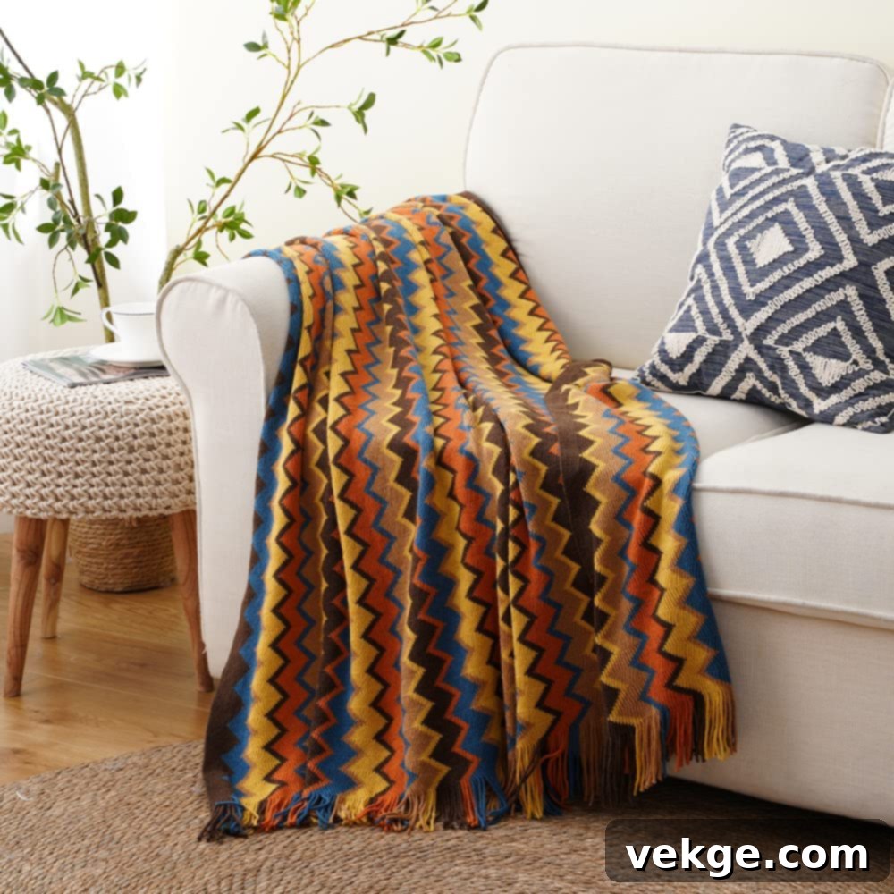 Cozy blankets and throw pillows on a sofa, perfect for fall farmhouse decor
