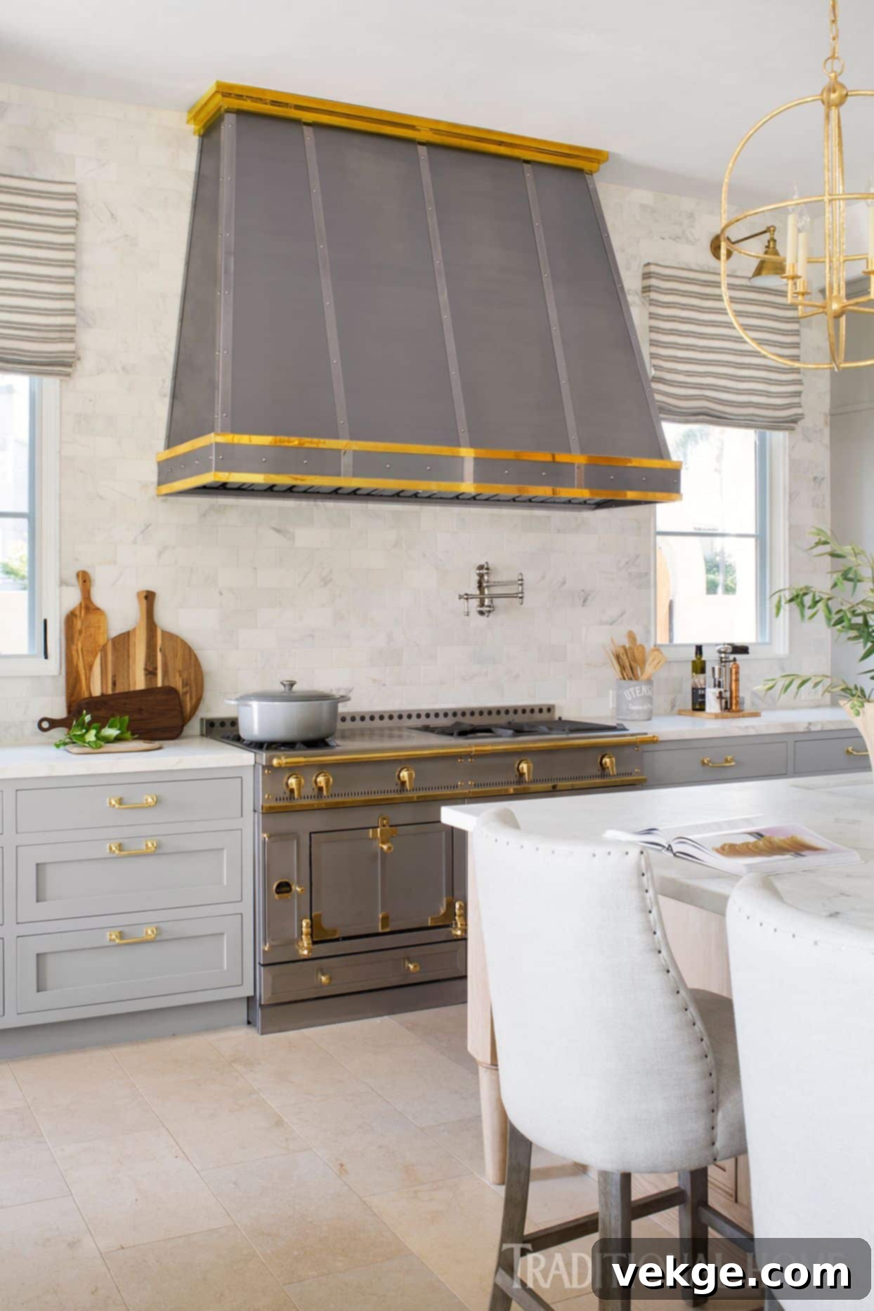 A bright and airy Parisian kitchen with white cabinetry, light wooden floors, and elegant details.