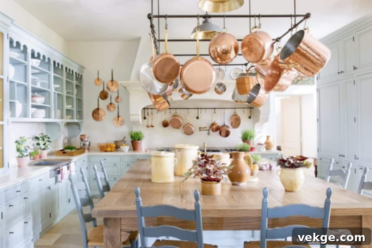 A collection of gleaming copper pots and pans hanging in a classic Parisian kitchen, adding warmth and traditional charm.
