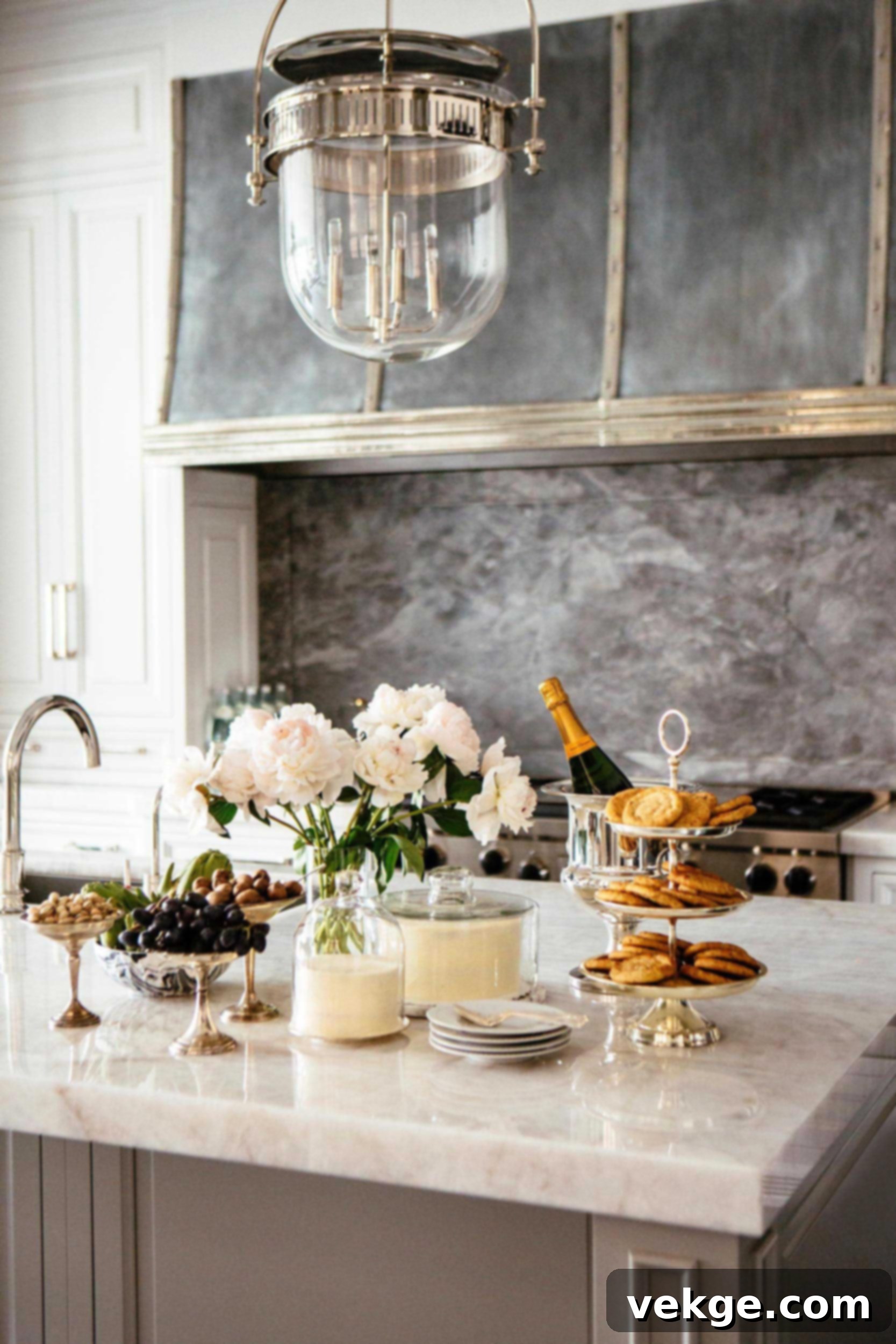 A pristine white marble backsplash with subtle grey veining, beautifully enhancing a sleek Parisian kitchen design.