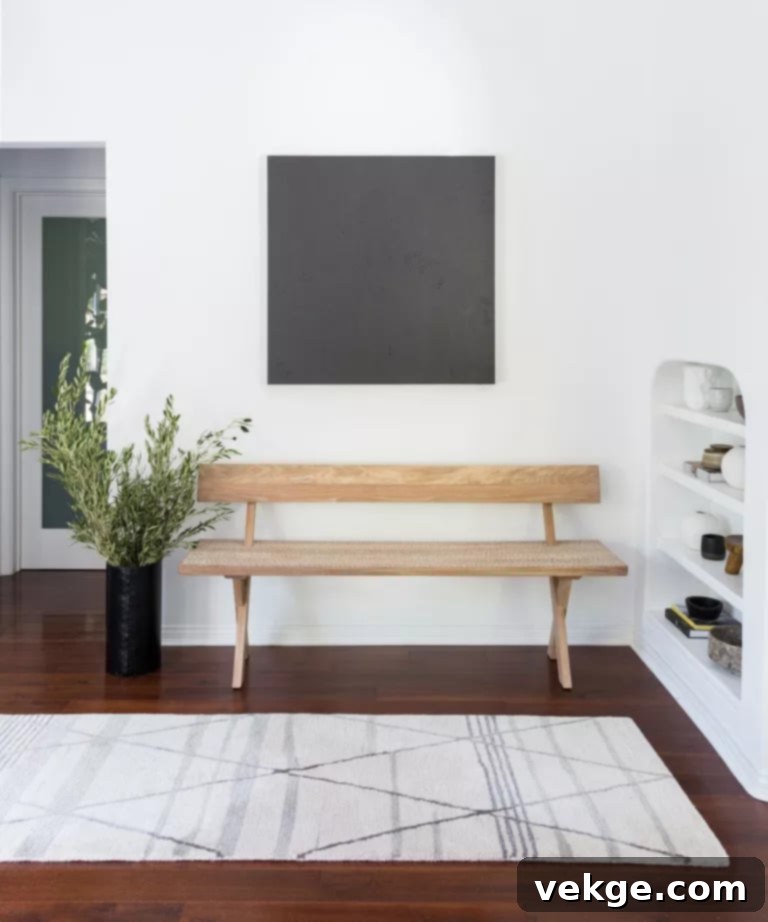 White Entryway Creating Calming Mid-Century Modern Aesthetic