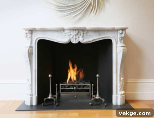 Stunning marble fireplace with roaring flames.