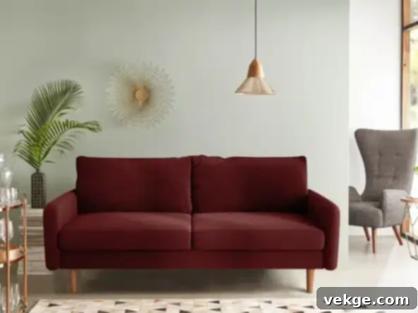 Mortenson Upholstered Sofa - Wine Red Velvet with Mid-Century Flair