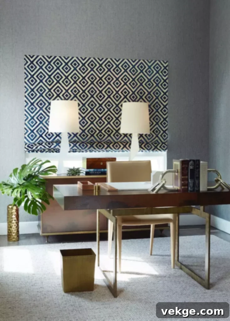 Home office with an accent wall featuring geometric wallpaper