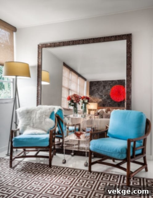 Small home office with a gold-framed mirror making the room appear larger