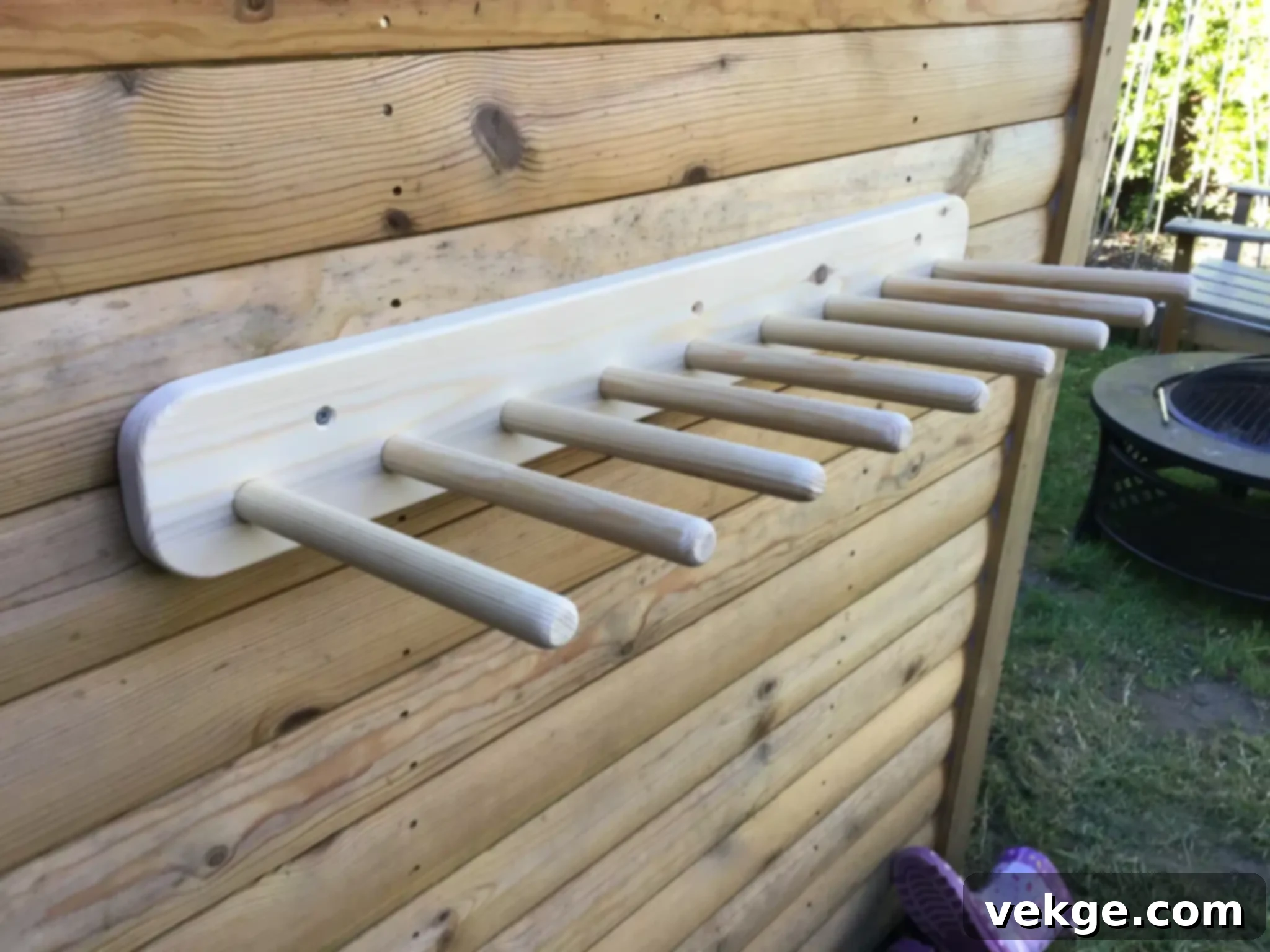 Boot organizer featuring wooden pegs to hang boots upside down
