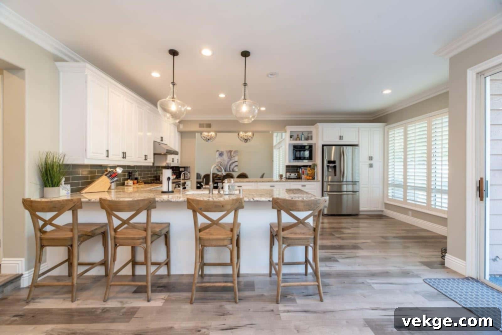 Elegant glass pendant lights illuminating a modern kitchen island