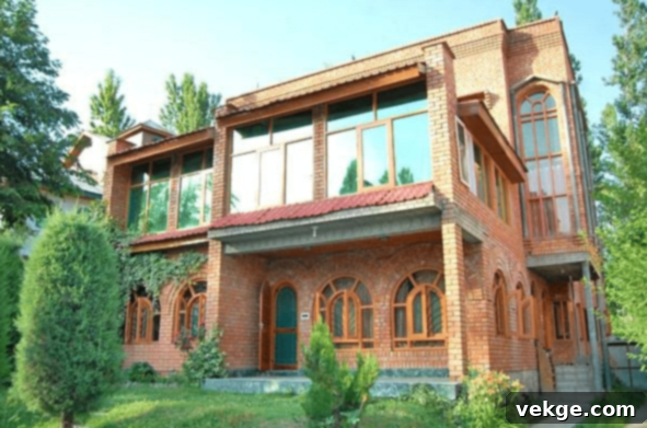 Traditional Wooden House in Kashmir with Sloping Roofs and Intricate Carvings