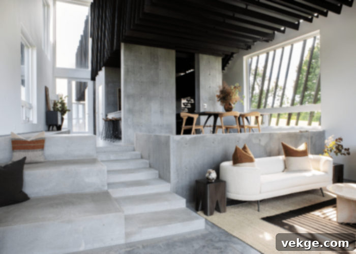 Smooth, unpainted concrete wall with a cool grey finish, providing a modern and expansive backdrop in a minimalist room.