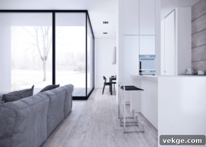 Elegant glass dining table in a bright minimalist room, reflecting natural light and enhancing the sense of space.
