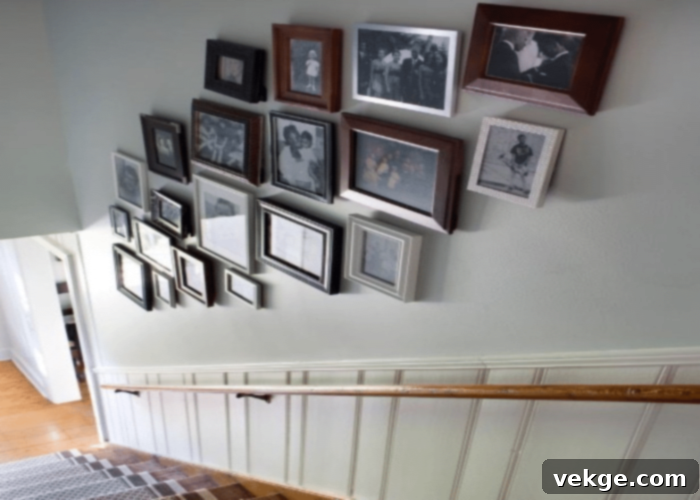 Staircase wall adorned with a classic gallery of photo frames, a timeless decor idea for any home
