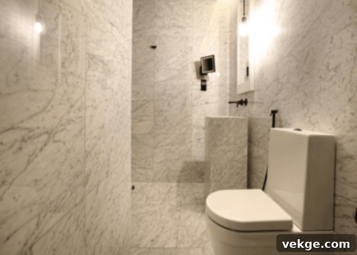 Luxurious marble flooring for an elegant dark green bathroom, showcasing natural veining