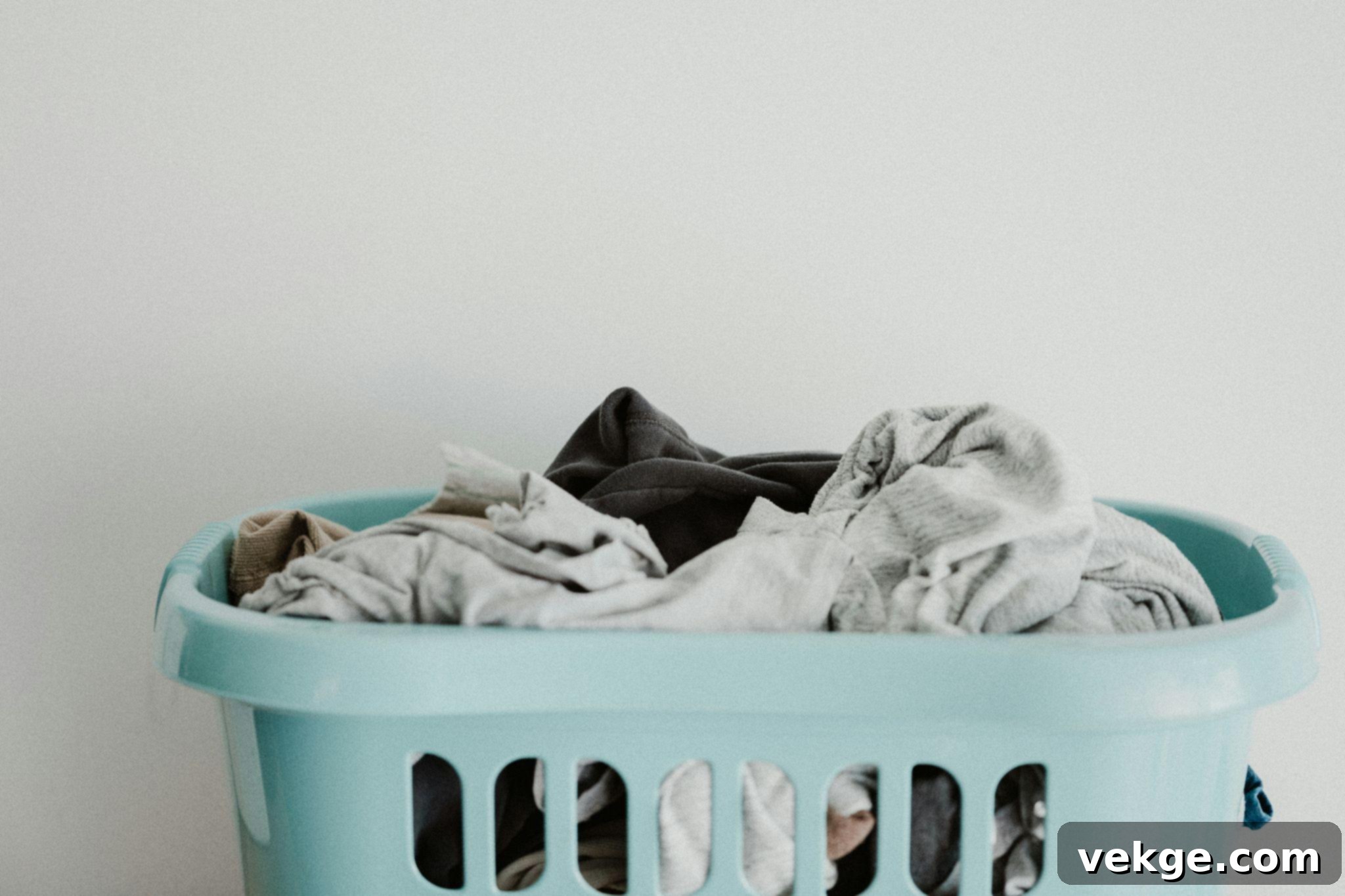 Modern laundry room with ample storage and counter space, featuring a large window for natural light.