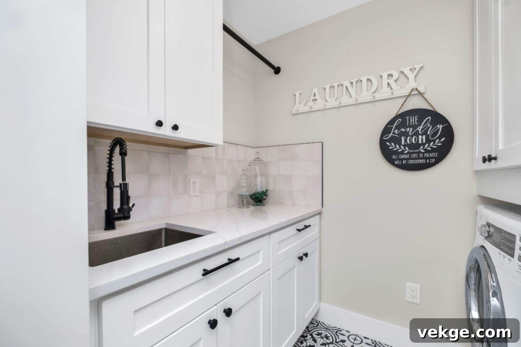 Bright and stylish laundry room with wooden accents and natural light, featuring a wall-mounted drying rack.