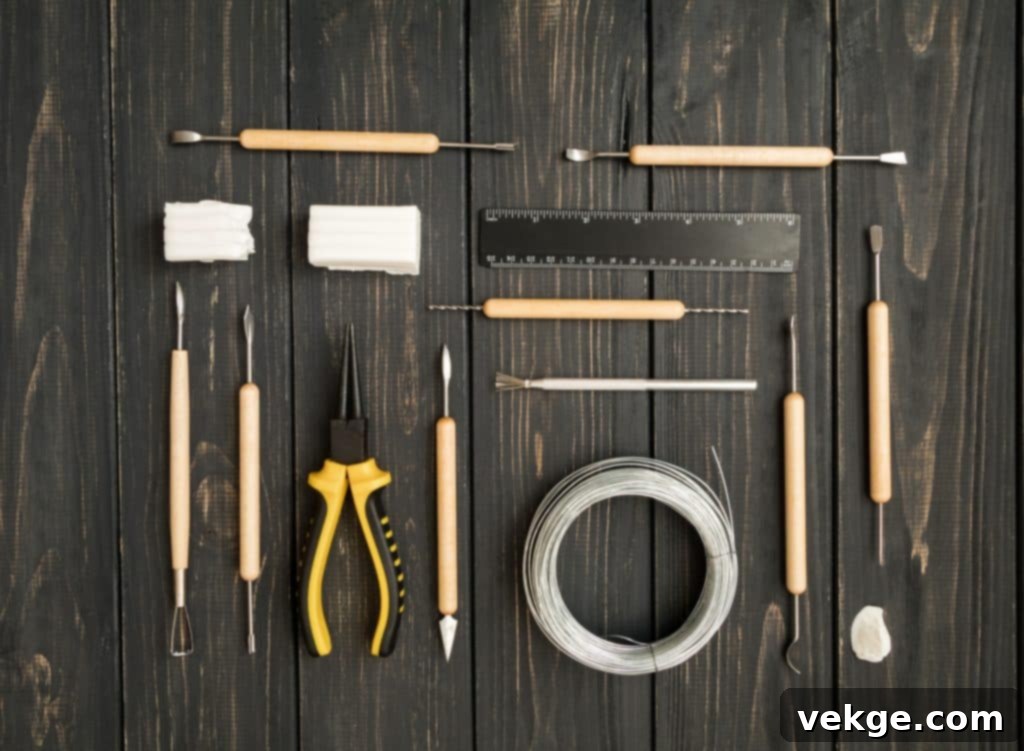 Craftsman workplace, ready for sculpturing from polymer clay. Vintage working table with molding tools. Art craft concept, hobby or work place. Flat lay, top view