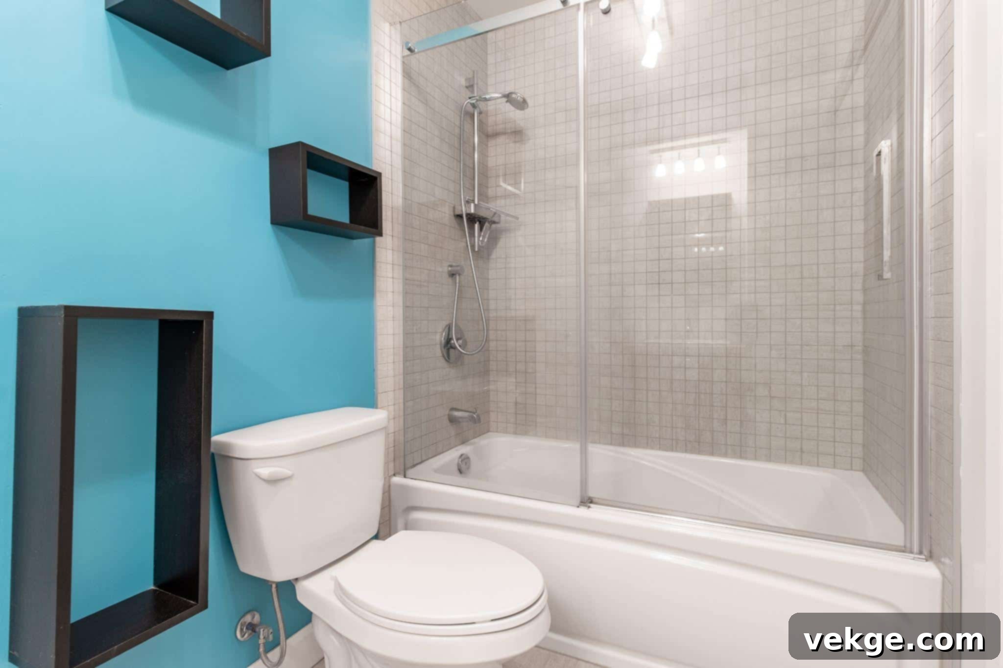 Glass enclosure above a bathtub, combining shower and bath functionality.