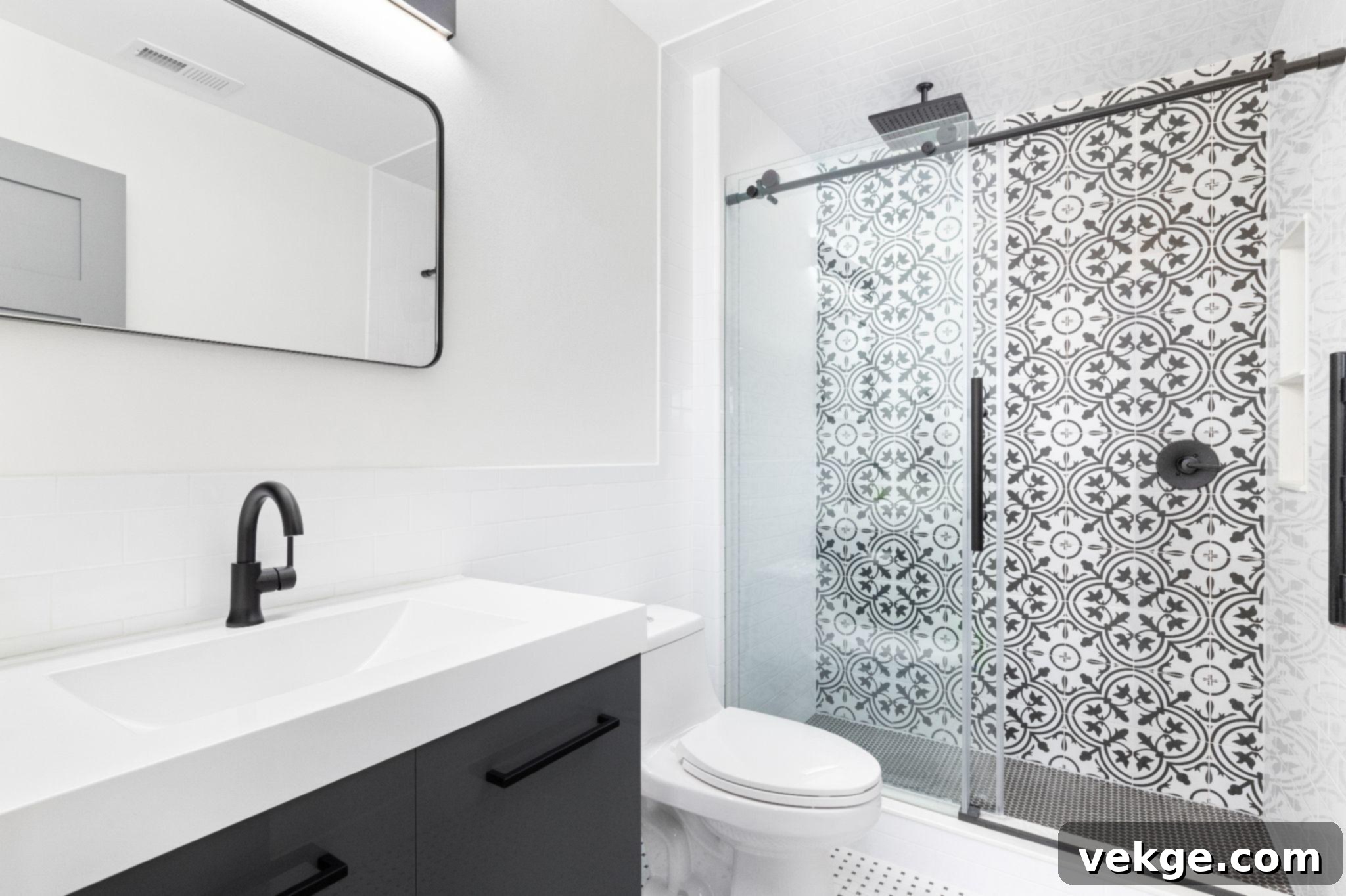 Contemporary sliding glass shower door in a modern bathroom.