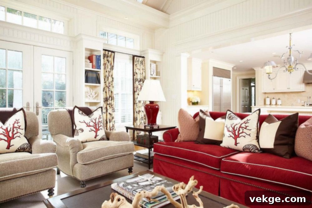 Cream walls complementing a red sofa for a luxurious living room
