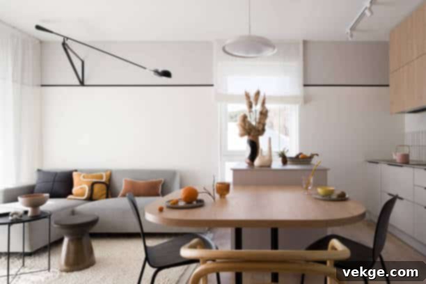 Small and stylish, open plan apartment with kitchen, dining area and living room with diverse flooring options.