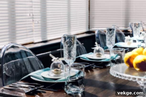 Private dining - Table Setting with Flowers Candles and Crystal Glass, showing elegant dining table decoration.