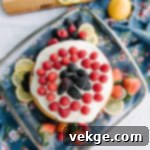 Sunshine Raspberry Lemon Cake 4 Raspberry Lemon Cake with frosting being applied