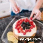 Sunshine Raspberry Lemon Cake 5 Side view of a fully frosted Raspberry Lemon Cake